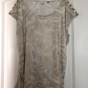 Shiny top with gold button shoulders